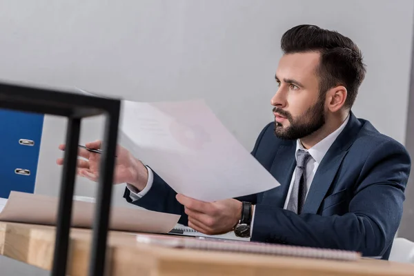 Businessman Sitting Table Holding Documents — Stock Photo, Image