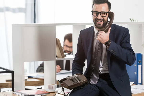 Businessman Talking Stationary Telephone Office Sitting Table — Stock Photo, Image