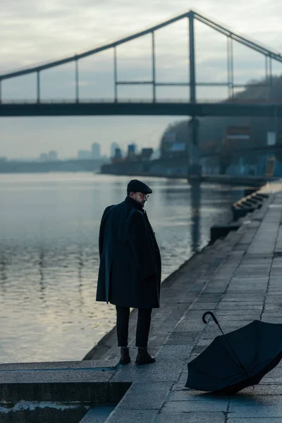 Handsome Middle Aged Man Looking Umbrella Lying River Shore — Stock Photo, Image