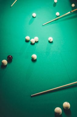 top view of green billiard table with russian pool balls and cues clipart