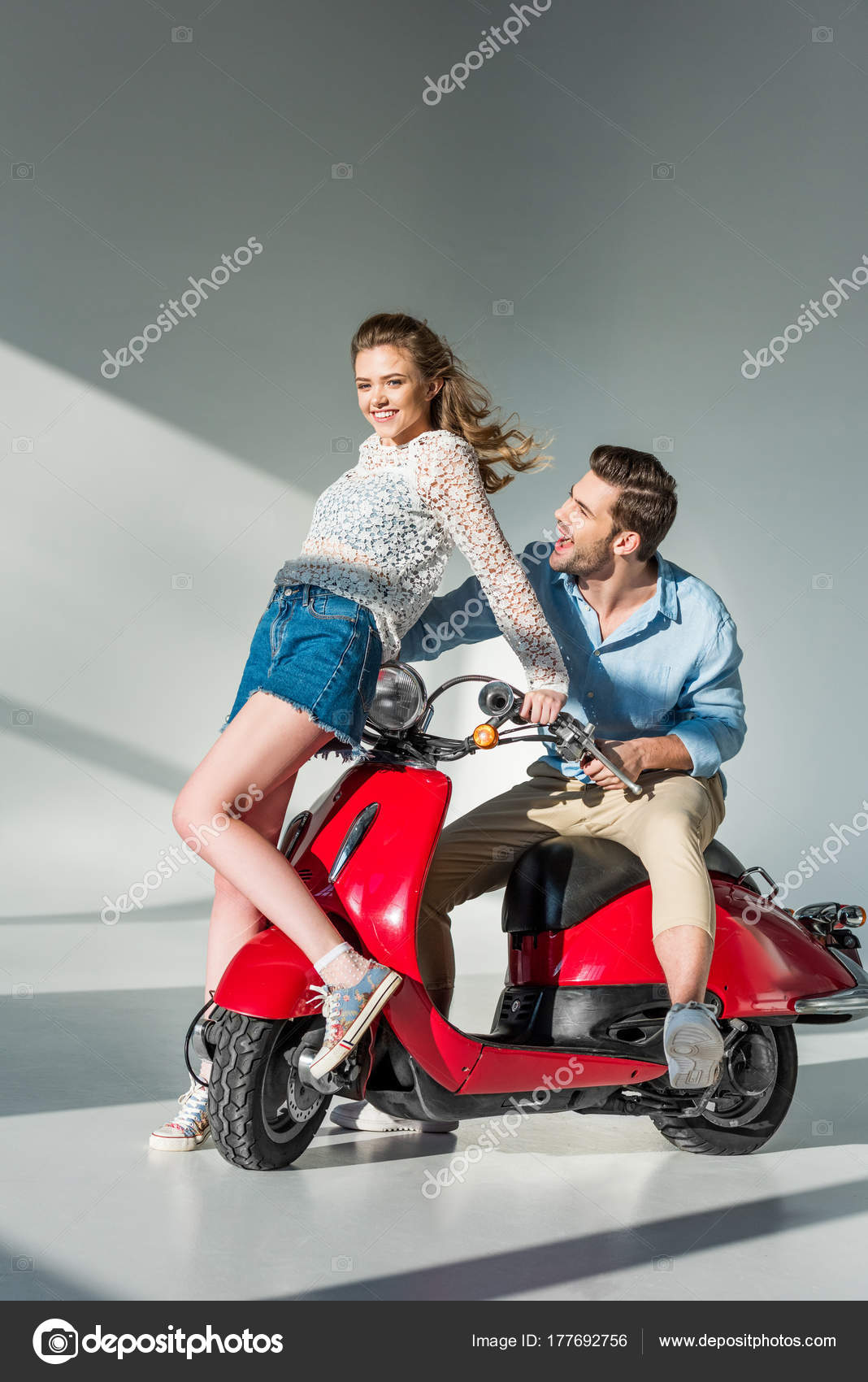 Sexy good looking girl posing on stylish scooter. Stock Photo by fxquadro