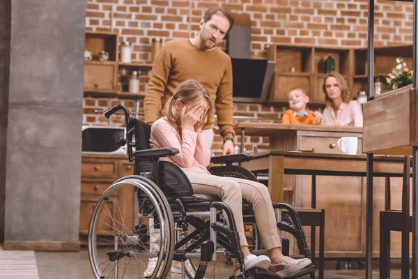 Father Looking Little Daughter Sitting Wheelchair Closing Eyes Palms Home — Stock Photo, Image