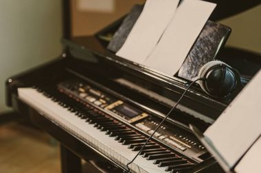 close-up shot of electric piano in sound recording studio clipart