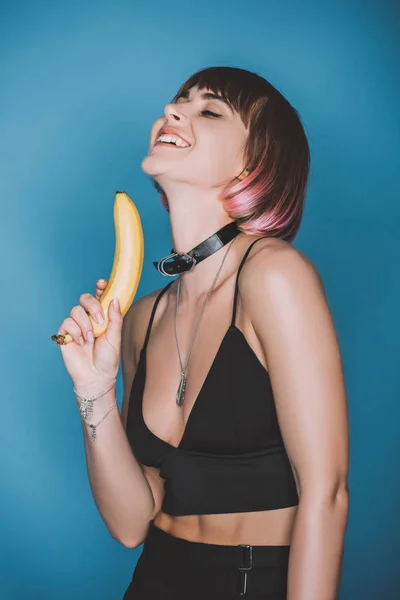 Smiling Girl Stylish Crop Top Holding Banana Isolated Blue — Stock Photo, Image