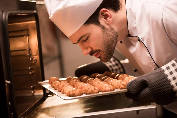 Side View Confectioner Looking Eclairs Baking Pan Hands — Stock Photo, Image