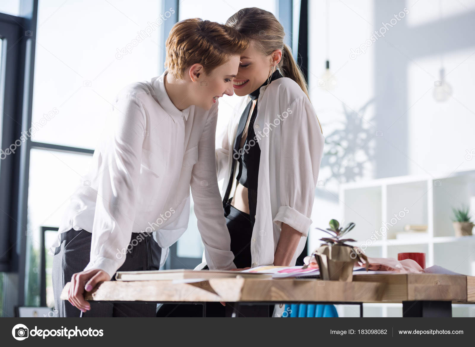 Lesbian kissing office