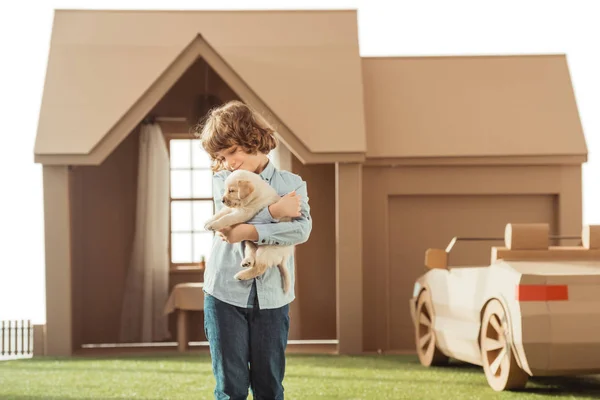 Little Kid Holding His Adorable Labrador Puppy Front Cardboard House — Stock Photo, Image