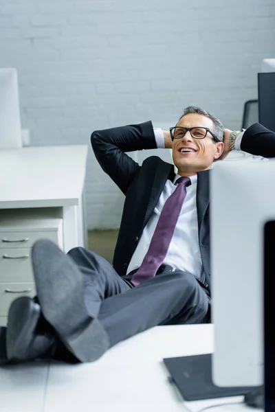 Smiling Businessman Hands Head Resting Workplace — Stock Photo, Image