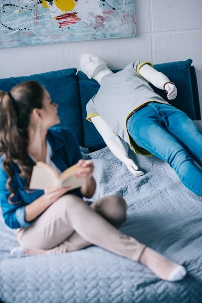 Selective Focus Woman Book Resting Bed Mannequin Loneliness Concept — Free Stock Photo