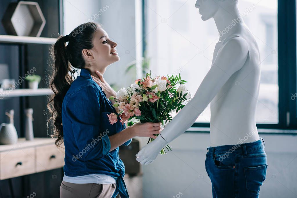 young woman pretending to receive flowers from layman doll, perfect relationship dream concept