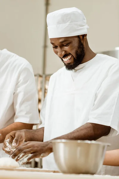 Handsome African American Baker Kneading Dough Pastry Baking Manufacture — Free Stock Photo