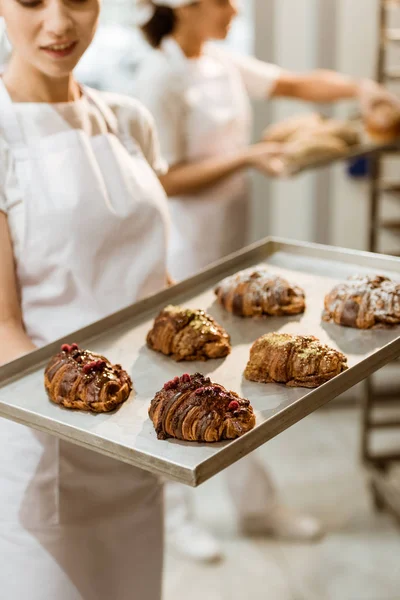 Close Shot Young Baker Holding Tray Fresh Croissants Baking Manufacture — Stock Photo, Image