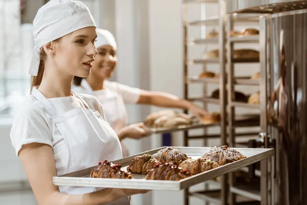 Attractive Young Baker Holding Tray Fresh Croissants Baking Manufacture — Stock Photo, Image