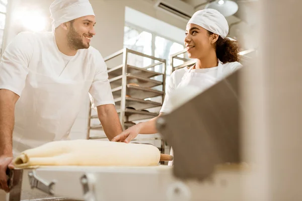 Happy Young Bakers Working Industrial Dough Roller Baking Manufacture — Stock Photo, Image