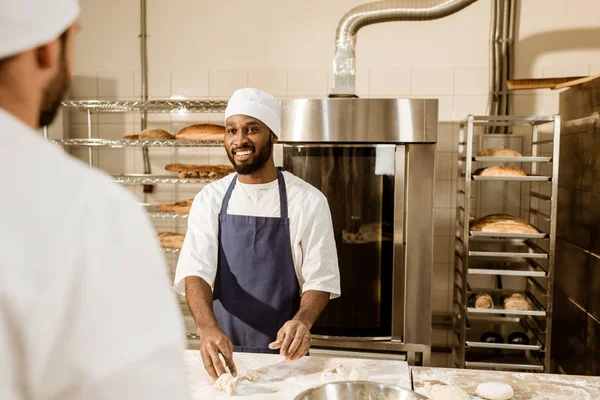 Young Bakers Kneading Dough Together Baking Manufacture — Stock Photo, Image