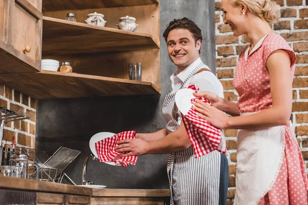 Couple Aprons Smiling Each Other While Washing Dishes Together 1950S — Stock Photo, Image