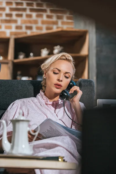 Blonde Woman Robe Reading Newspaper Talking Vintage Telephone — Free Stock Photo