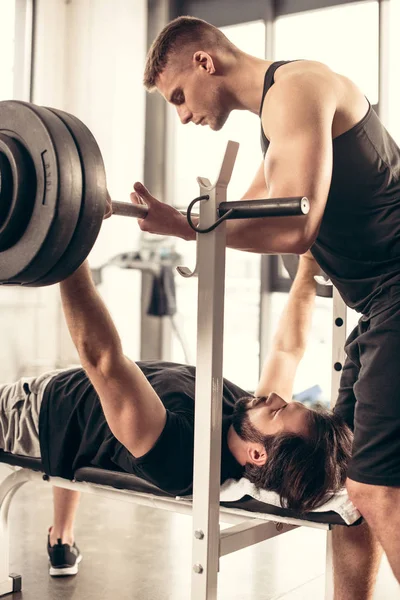 Handsome Trainer Helping Sportsman Lifting Barbell Gym — Stock Photo, Image