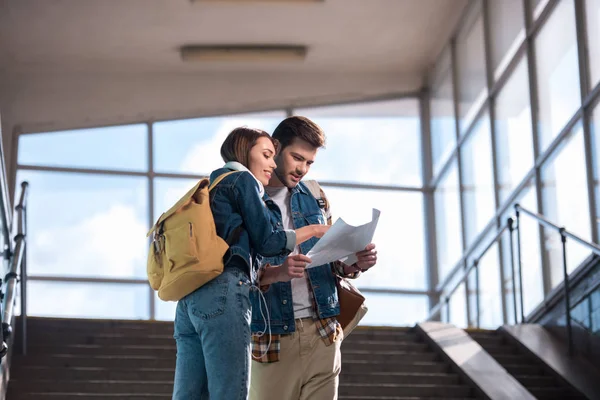 Smiling Young Woman Helping Male Traveler Map Hands Subway — Stock Photo, Image