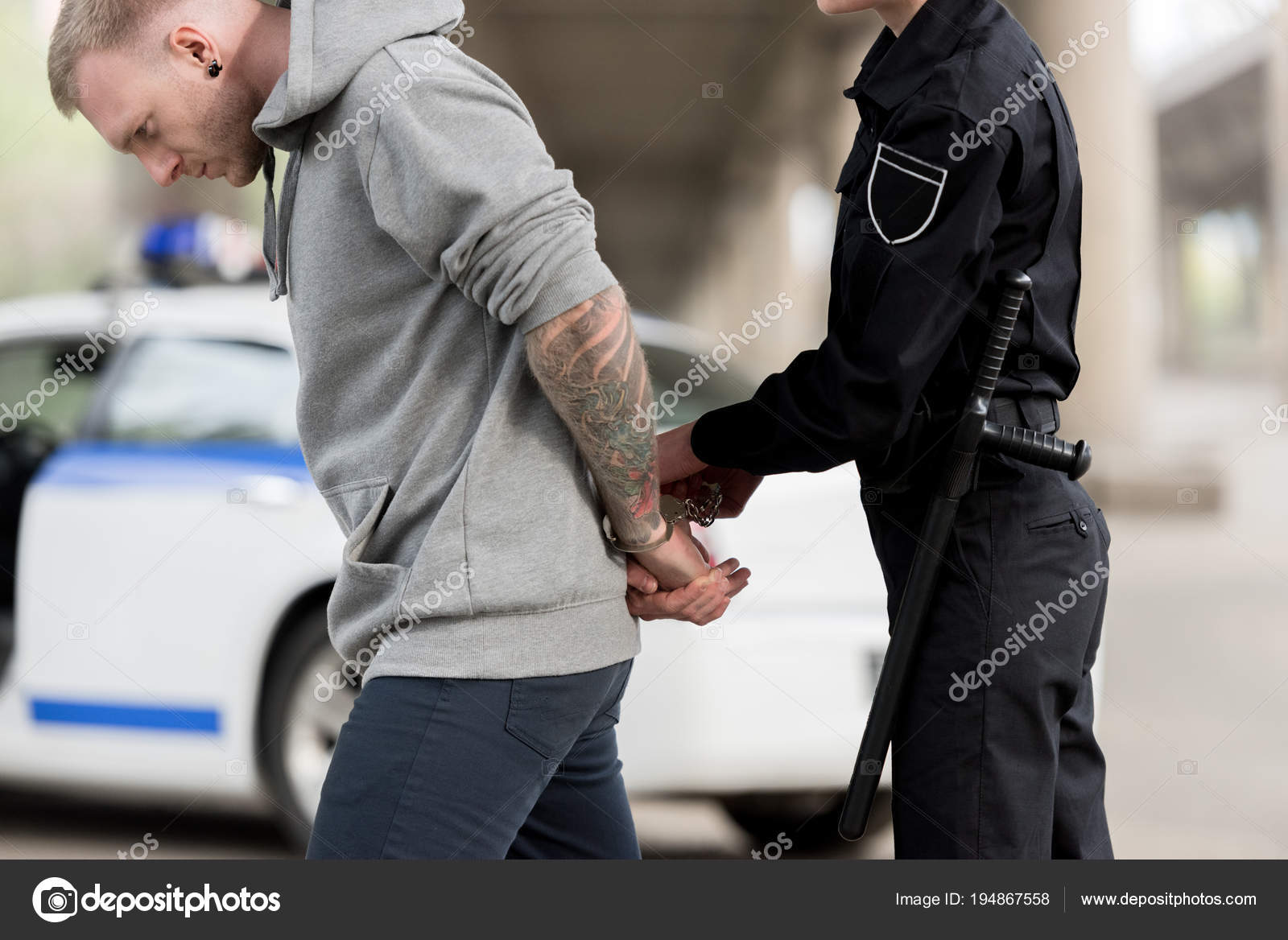 Women Officers Handcuffing Men