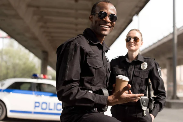 Happy Young Police Officers Having Coffee Break — Stock Photo, Image