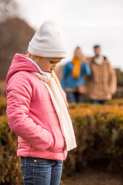 Sad little girl standing outdoors — Stock Photo