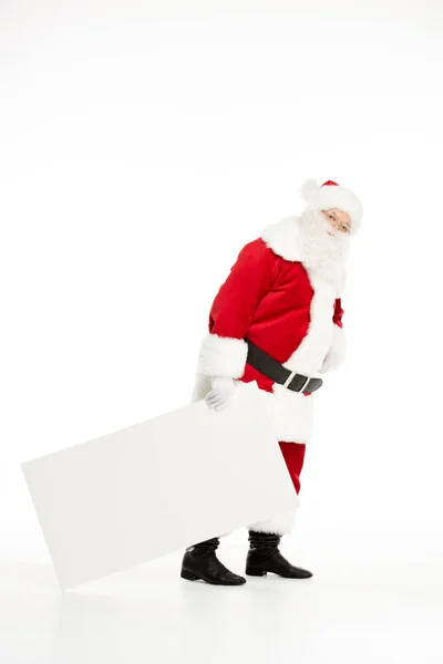 Санта-Клаус тянет белую доску — стоковое фото