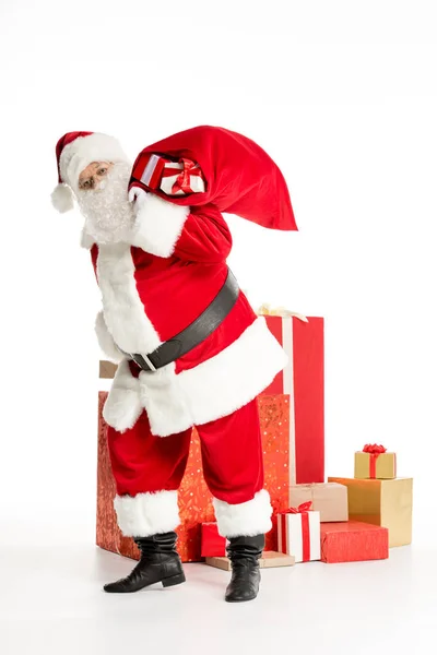 Papai Noel com pilha de presentes de Natal — Fotografia de Stock