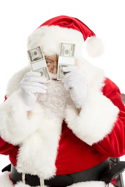 Санта Клаус подглядывает из банкнот в долларах — стоковое фото