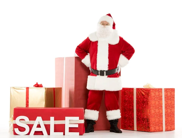 Père Noël debout avec signe de vente — Photo de stock