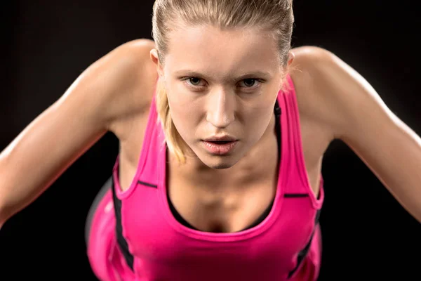 Young sportswoman doing push ups — Stock Photo