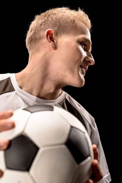 Soccer player holding ball — Stock Photo
