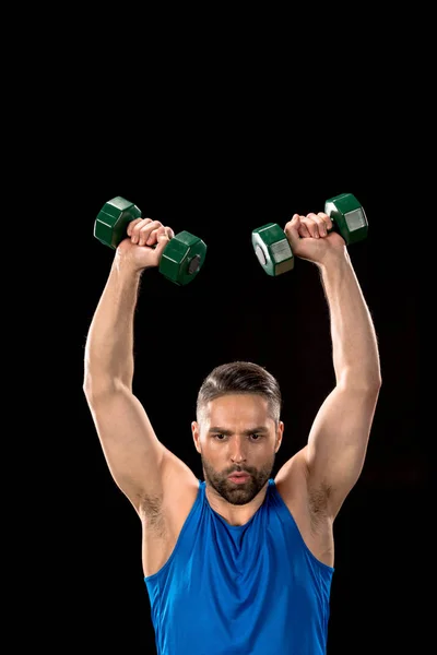 Homem esportivo com halteres — Fotografia de Stock