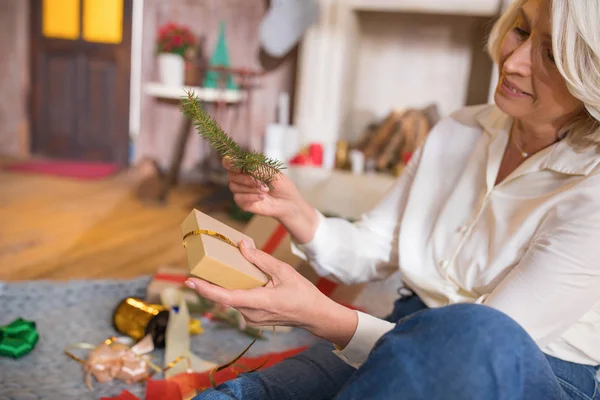 Woman wrapping christmas present — Stock Photo