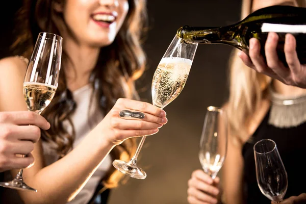 Happy friends drinking champagne — Stock Photo