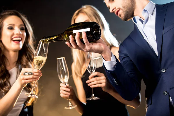 Happy friends drinking champagne — Stock Photo