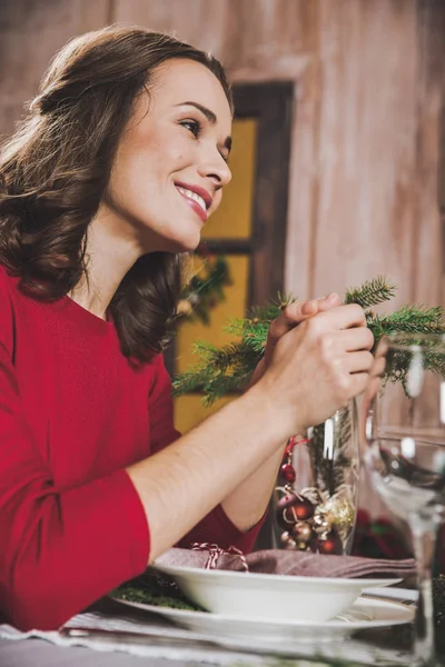 Attractive woman at holiday table — Stock Photo