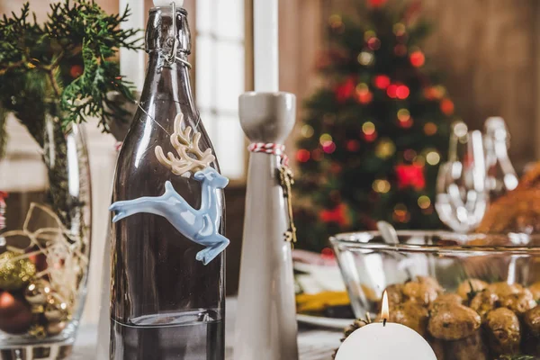 Christmas decorations on festive table — Stock Photo