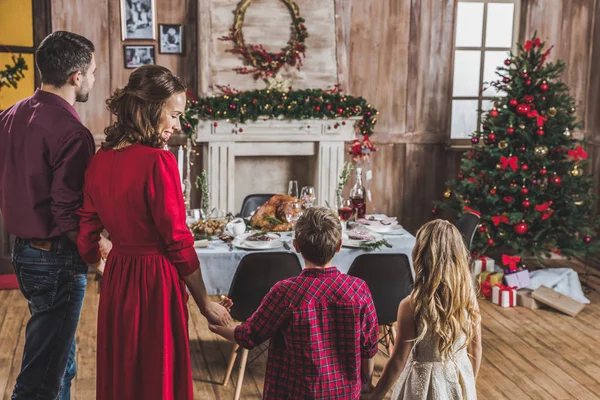 Happy family holding hands — Stock Photo