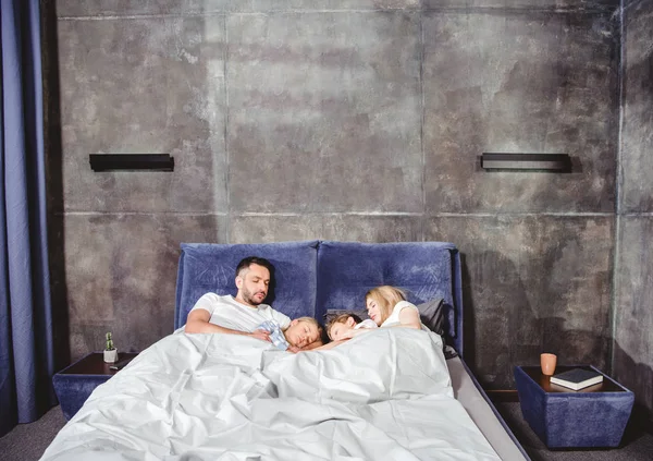 Happy family in bed — Stock Photo