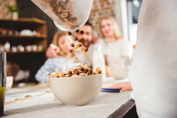 Pouring corn flake rings — Stock Photo