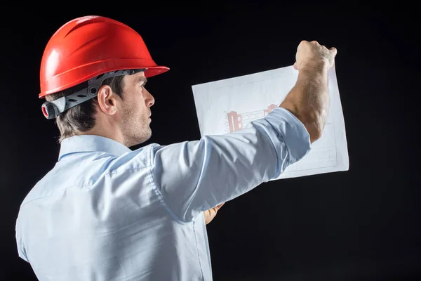 Male engineer with blueprint — Stock Photo