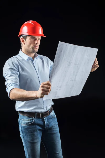 Male engineer with blueprint — Stock Photo