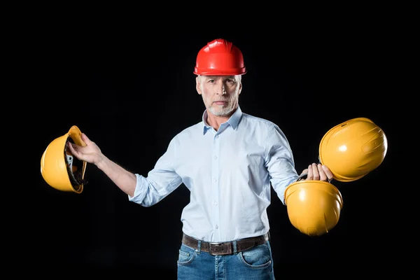 Man holding hard hats — Stock Photo