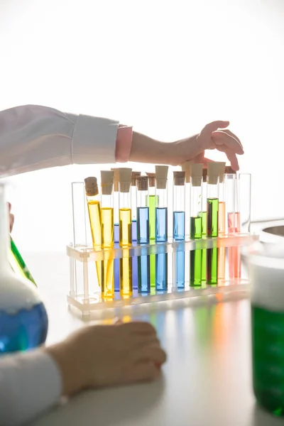 Schoolchild with test tubes — Stock Photo