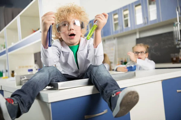 Boy sitting in sink — Stock Photo