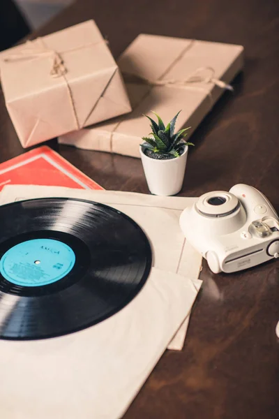 Vinyl record and camera — Stock Photo