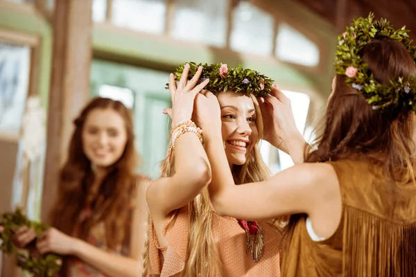 Bohemian women wearing floral wreaths — Stock Photo
