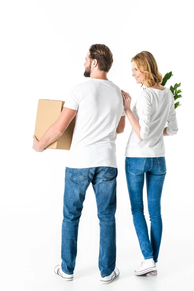 Couple holding box and plant — Stock Photo