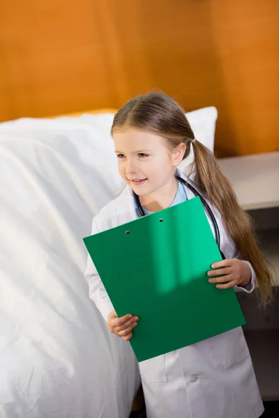 Little girl pretending to be doctor — Stock Photo